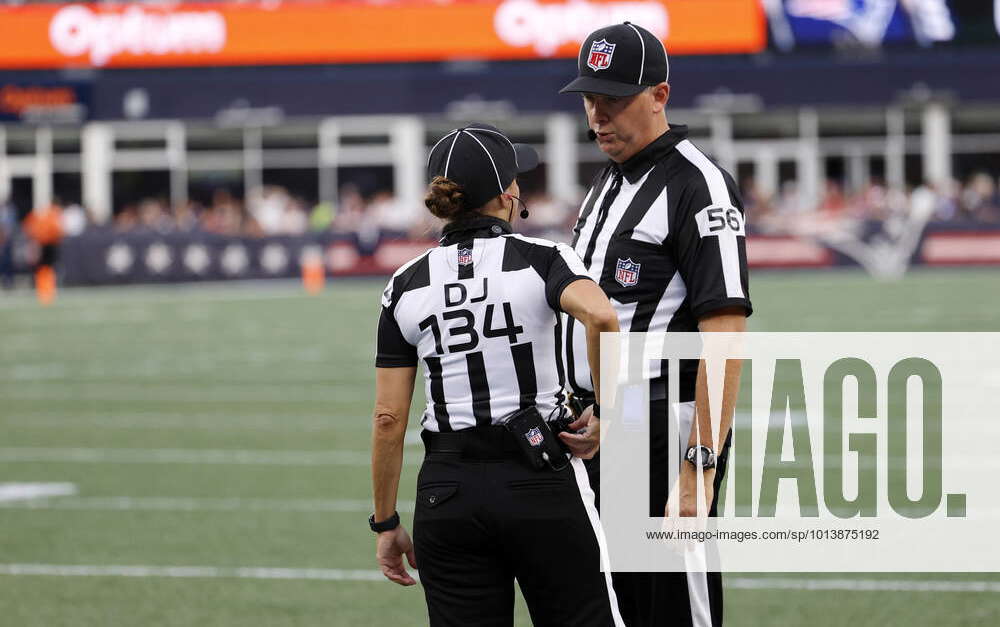 FOXBOROUGH, MA - AUGUST 11: Side judge Allan Baynes (56) confers