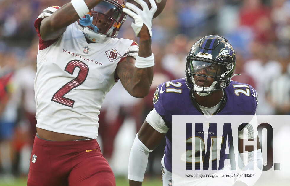 Washington Commanders WR Dyami Brown (2) catches a pass while being  defended by Baltimore Ravens DB Brandon Stephens (21) during a preseason  game at M&T Bank Stadium in Baltimore, Maryland on August