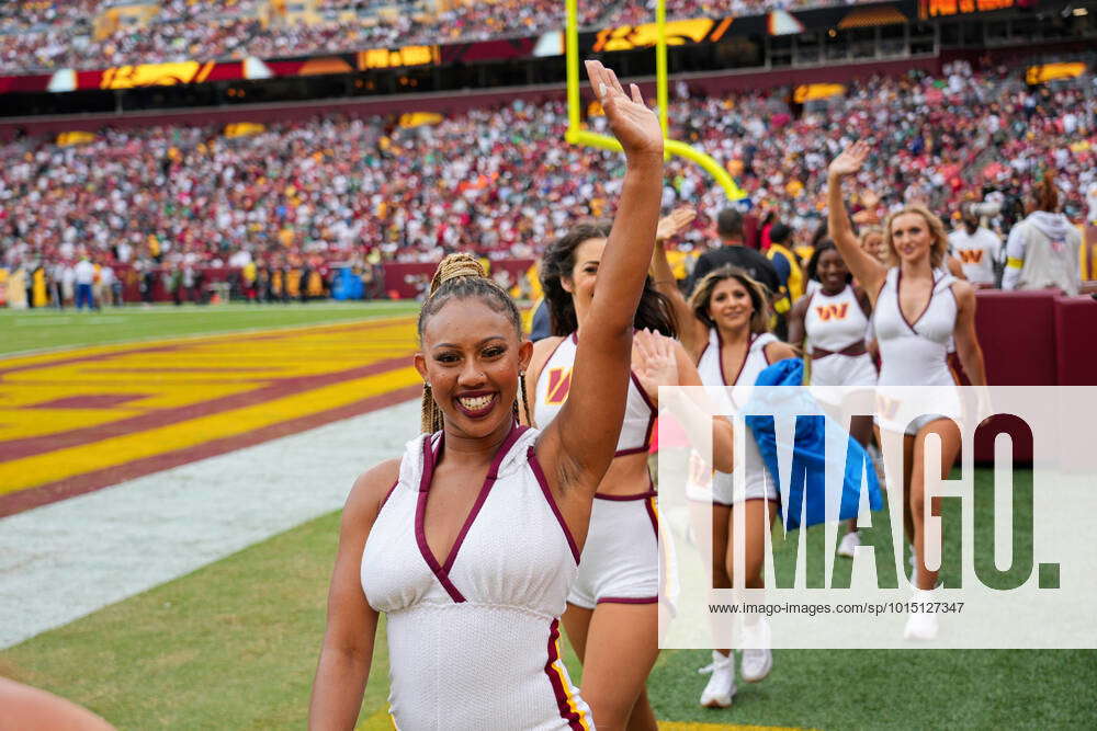 LANDOVER, MD - SEPTEMBER 25: Washington Commanders cheerleader performs  during the game between the