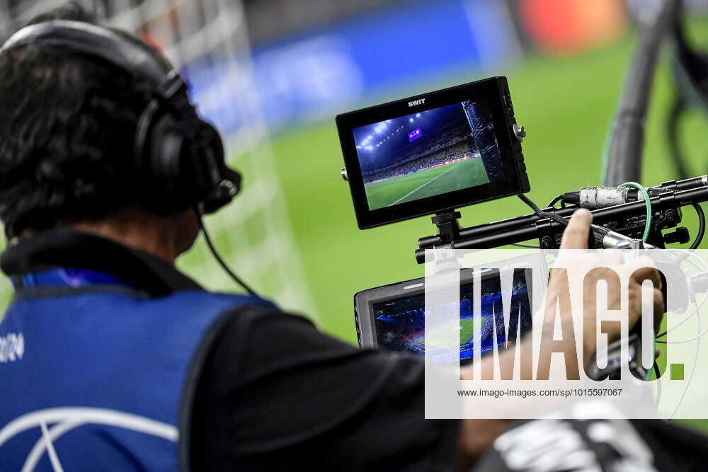 Football Gaoal Monitor A cameraman watches in the monitor as he shoots with the camera ...