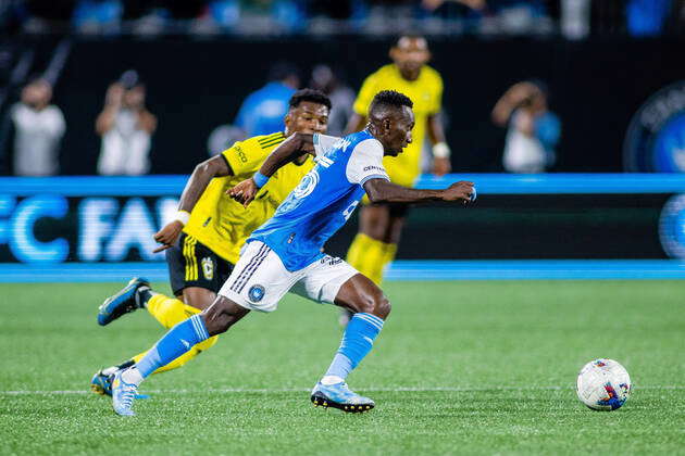 : Charlotte FC defender Harrison Afful heads the ball a way after a ...