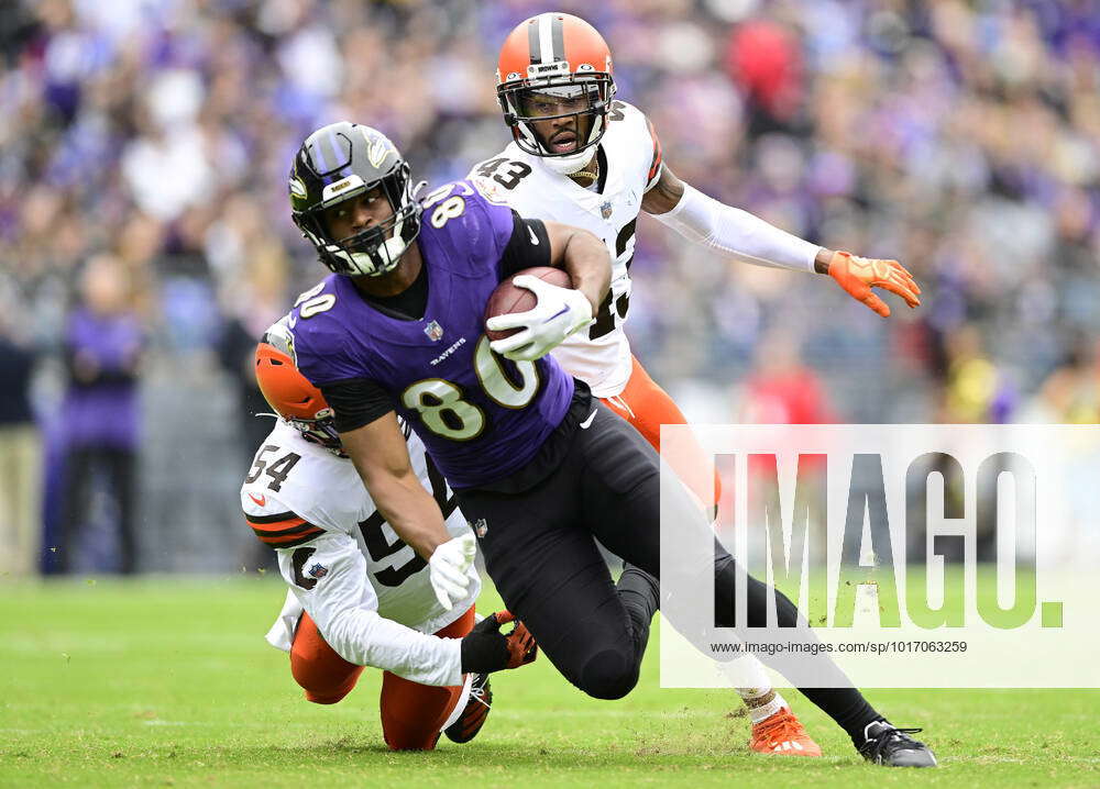 Baltimore Ravens tight end Isaiah Likely (80) runs for a first down past  Cleveland Browns linebacker