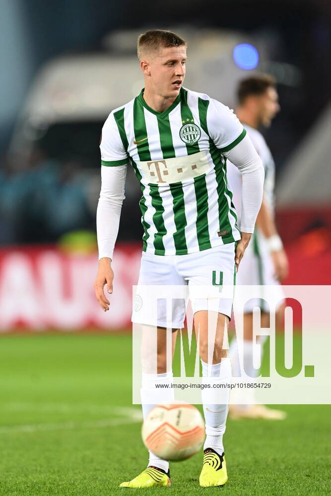 Mats Knoester of Ferencvarosi TC competes for the ball with