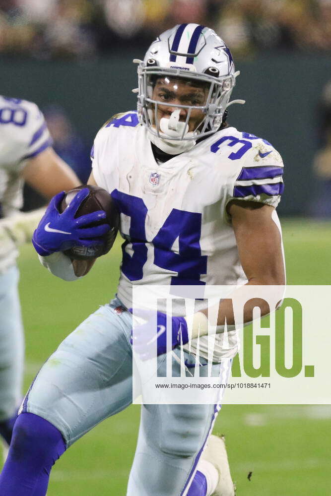 GREEN BAY, WI - NOVEMBER 13: Dallas Cowboys running back Malik Davis (34)  runs during a game between the Green Bay Packers and the Dallas Cowboys at  Lambeau Field on November 13