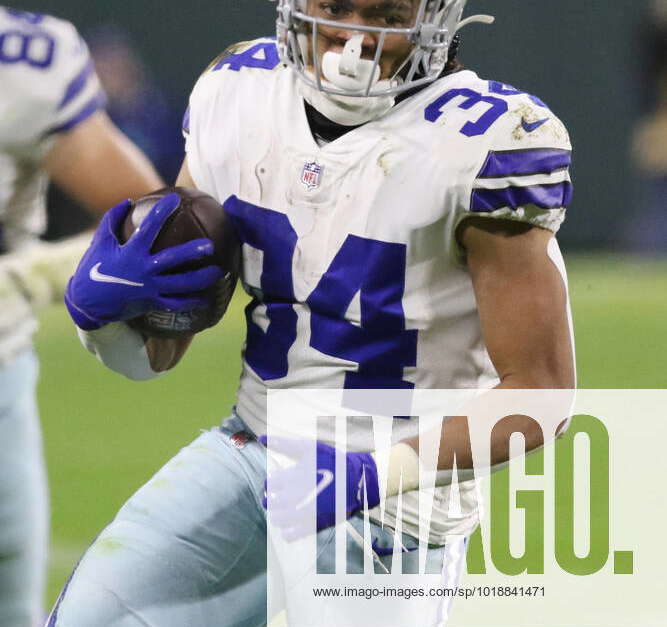 GREEN BAY, WI - NOVEMBER 13: Dallas Cowboys running back Malik Davis (34)  runs during a game between the Green Bay Packers and the Dallas Cowboys at  Lambeau Field on November 13