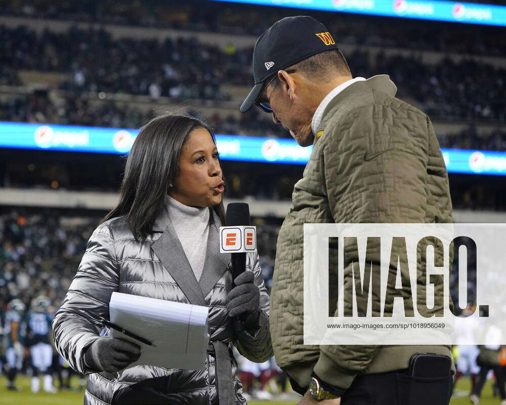 PHILADELPHIA, PA - NOVEMBER 14: ESPN sideline reporter Lisa Salters  interviews Washington Commanders Head Coach Ron Rivera at the end of the  first quarter of the National Football League game between the