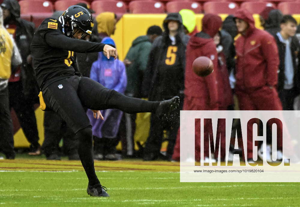 LANDOVER, MD - NOVEMBER 27: Washington Commanders punter Tress Way (5)  warms up prior to the NFL,