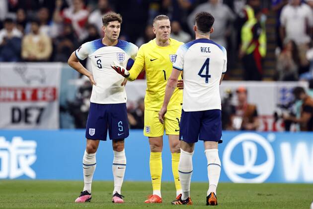 AL KHOR l r John Stones of England, England goalkeeper Jordan Pickford ...