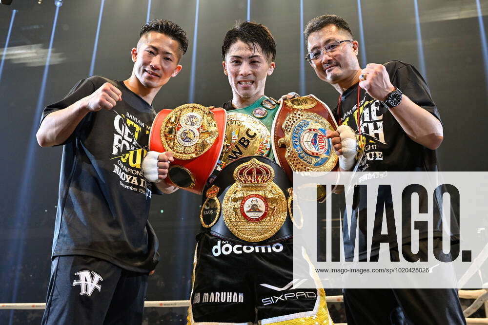 Naoya Inoue (C) of Japan celebrates with his brother Takuma Inoue (L