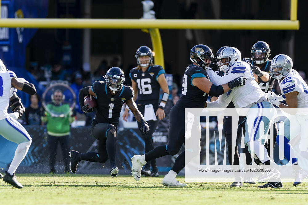 December 18, 2022: Jacksonville Jaguars running back TRAVIS ETIENNE JR. (1)  runs onto the field during the Jacksonville Jaguars vs Dallas Cowboys NFL  game at TIAA Bank Field Stadium in Jacksonville, Fl