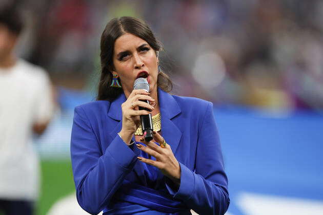 DOHA, QATAR: Singer Farrah El Dibany sings the national anthem of ...