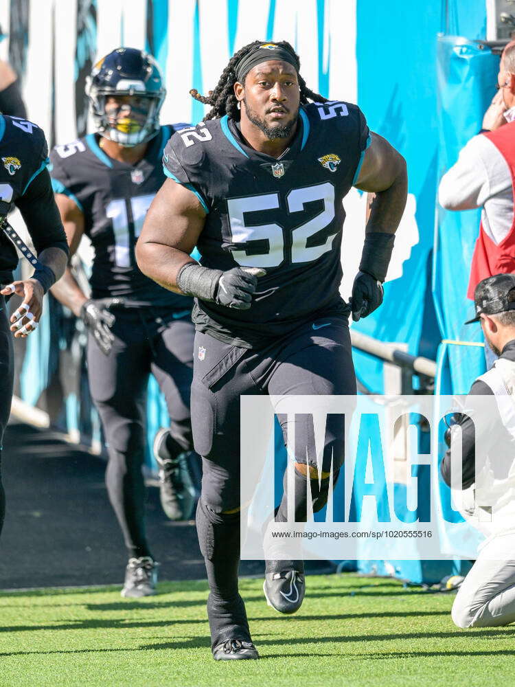 JACKSONVILLE, FL - NOVEMBER 27: Jacksonville Jaguars defensive tackle DaVon  Hamilton (52) reacts aft