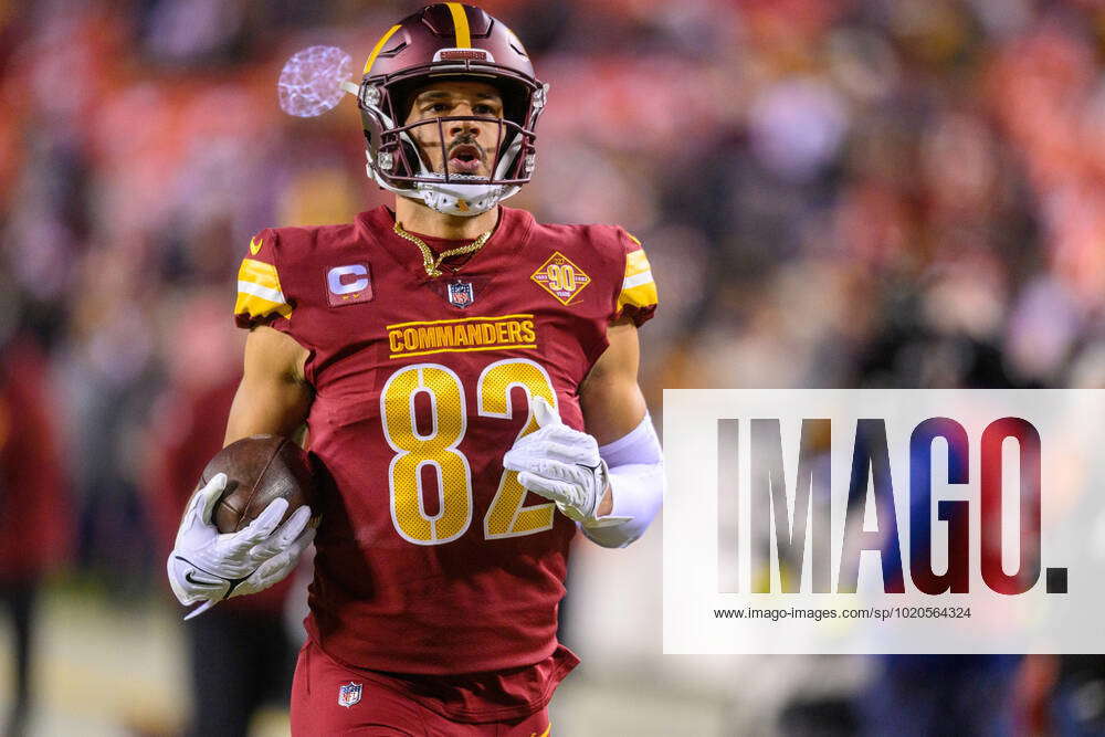 Washington Commanders tight end Logan Thomas (82) warms up before