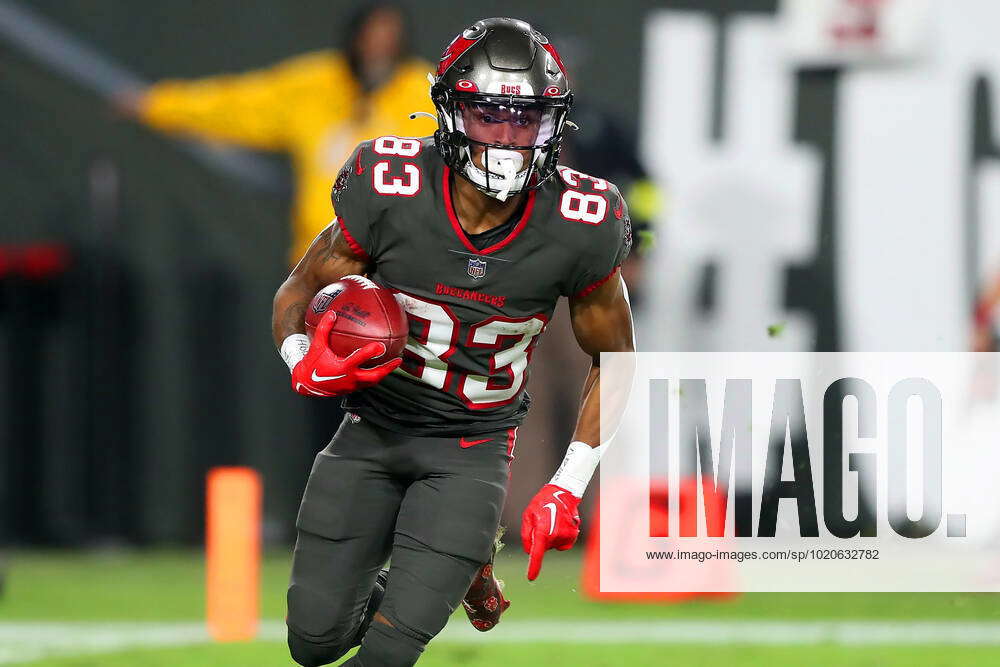 TAMPA, FL - DECEMBER 18: Tampa Bay Buccaneers kick returner Deven Thompkins  (83) carries the ball du