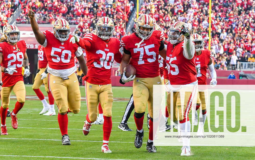 SANTA CLARA, CA - DECEMBER 24: San Francisco 49ers defensive end Jordan  Willis (75) gets escorted in