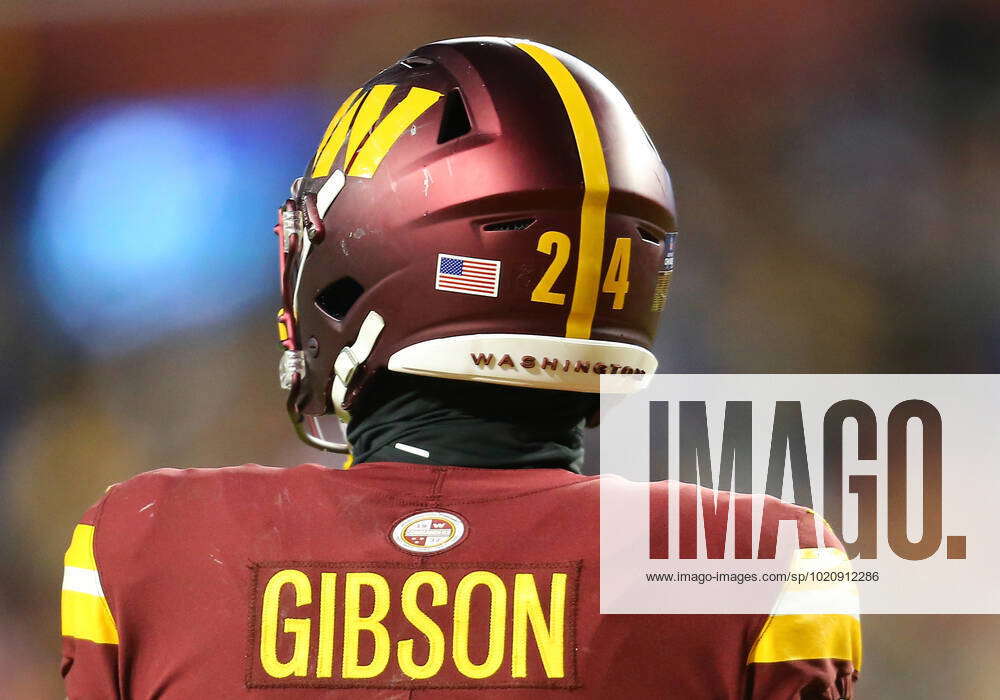 LANDOVER, MD - DECEMBER 18: Washington Commanders running back Antonio  Gibson (24) looks on during t