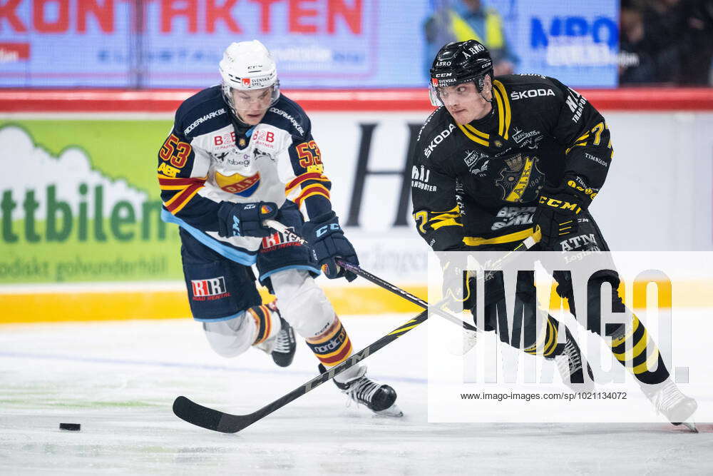 221229 Djurgardens David Blomgren and AIKs Eric Norin during the ice ...