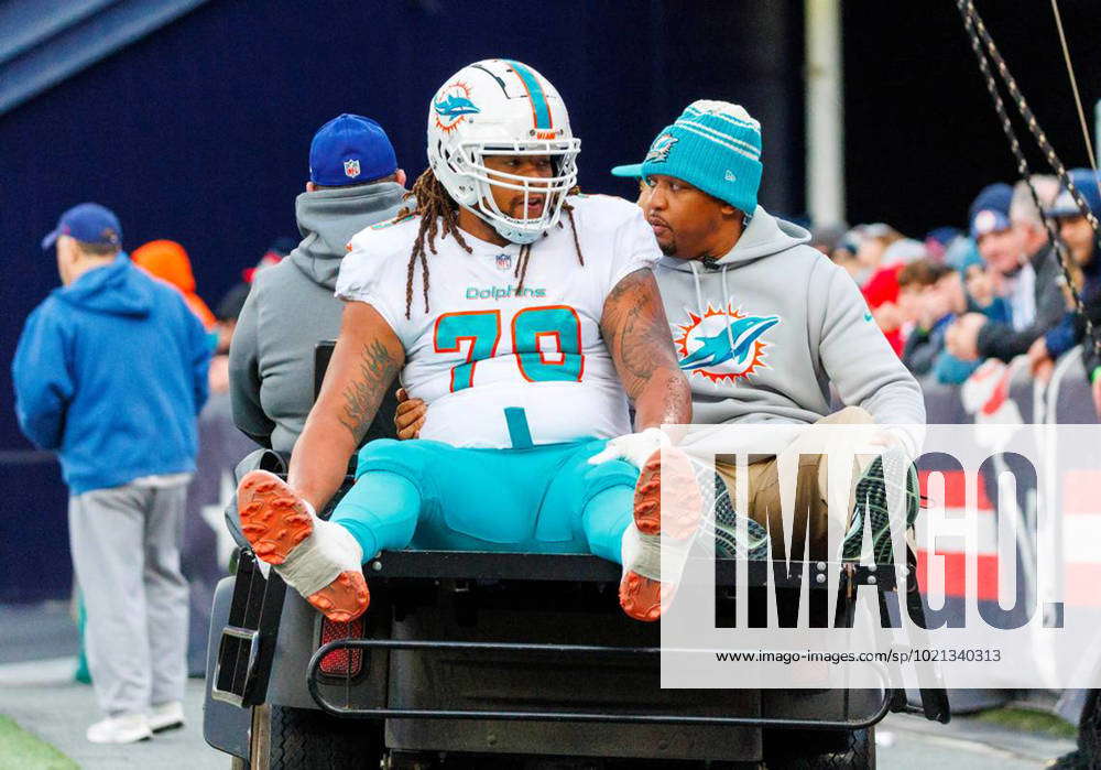 January 2, 2023: Miami Dolphins offensive tackle Kendall Lamm (70) is  carted off the field after