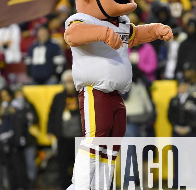 The Washington Commanders mascot Major Tuddy walks on the sidelines before  an NFL football game between the Commanders and the Dallas Cowboys, Sunday,  Jan. 8, 2023, in Landover, Md. (AP Photo/Nick Wass