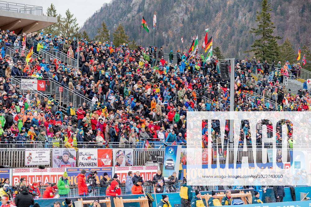 Crowded spectator stands at the finish or at the shooting range 20 ...