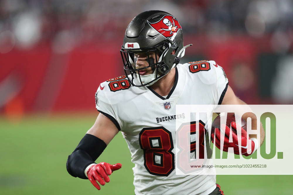 Tampa Bay Buccaneers tight end Cade Otton (88) runs after the