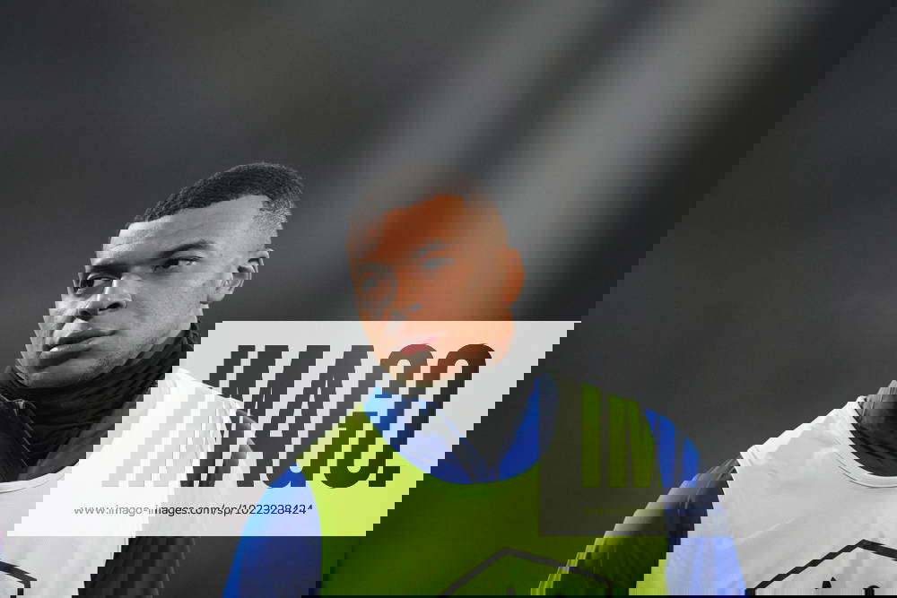 LENS, FRANCE - JANUARY 23: Kylian Mbappe warms up prior to the round of