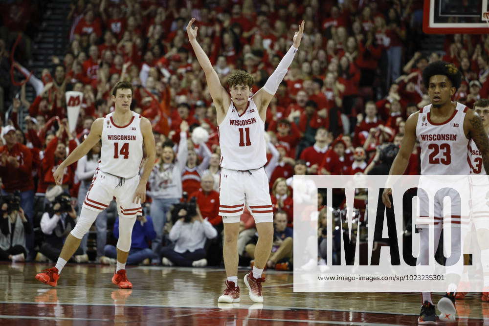 January 28, 2023: Wisconsin Badgers guard Max Klesmit (11) tries to get the crowd pumped up during