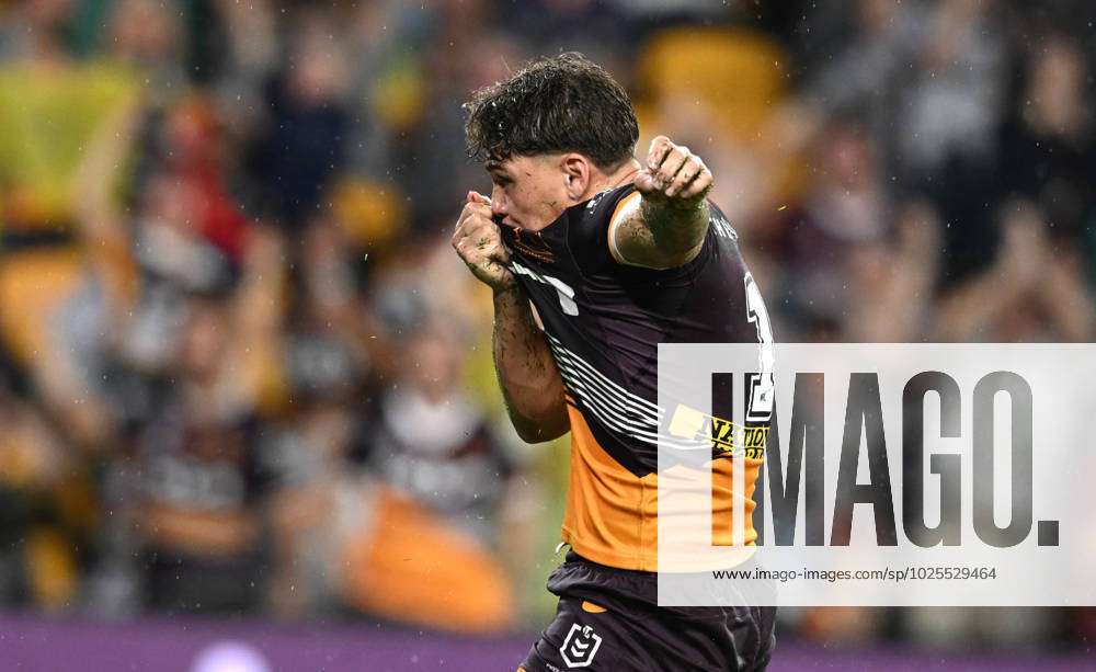 NRL BRONCOS COWBOYS, Reece Walsh of the Broncos kiss his jersey after  scoring a try during the NRL