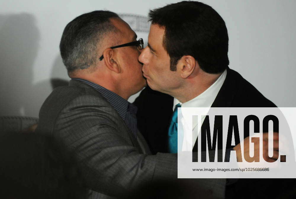 News: John Travolta April 12, 2011; New York, NY, USA; John Travolta kisses John  Gotti, Jr.