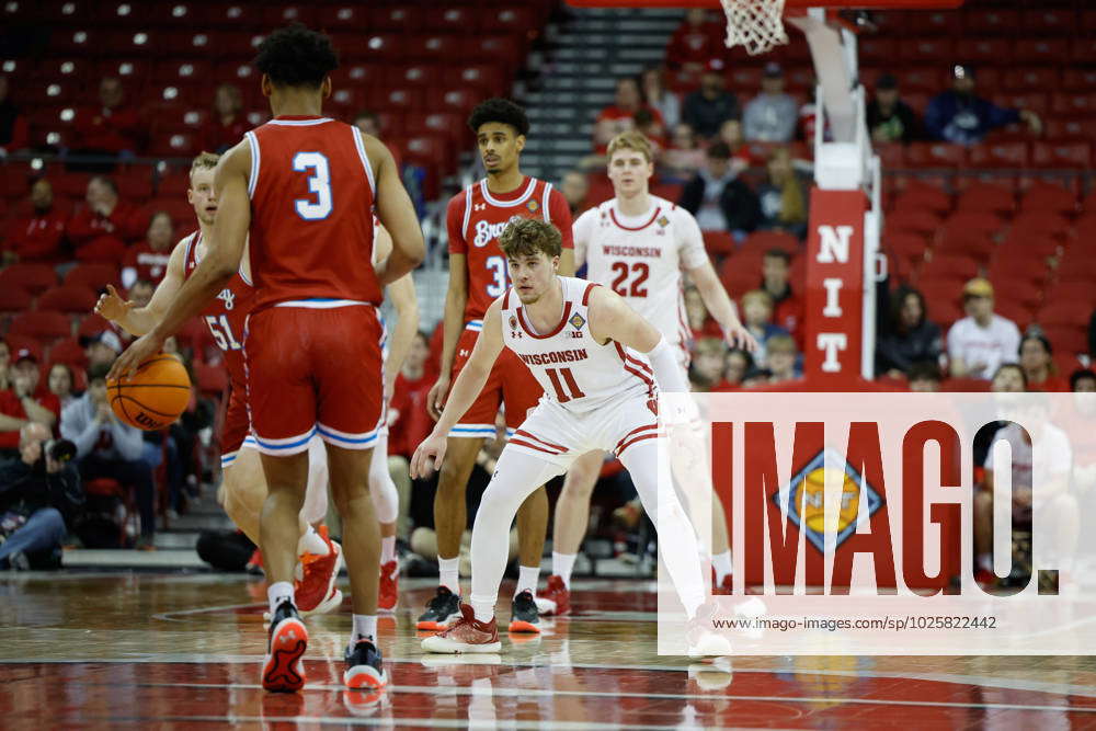 March 14, 2023: Wisconsin Badgers guard Max Klesmit (11) defends ...