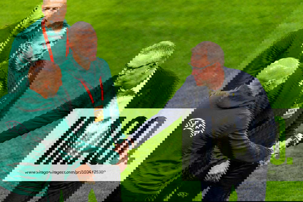 230324 Head coach Janne Andersson of Sweden greets the referees ahead