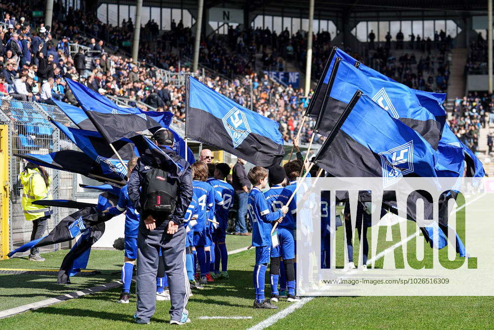 Young fans with flag, club flag with logo of SV Waldhof Mannheim ...