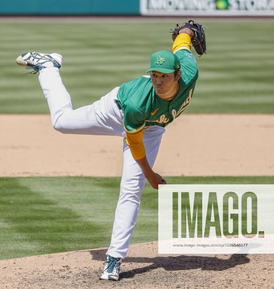 Shintaro Fujinami of the Oakland Athletics pitches against the Milwaukee  Brewers in a spring training game