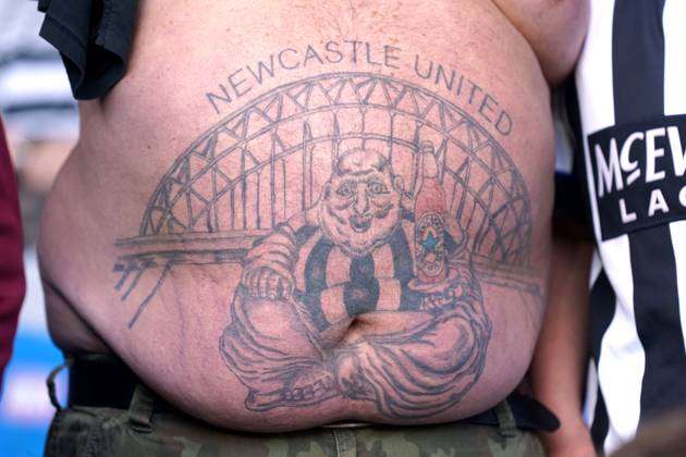 A tattoo on the leg of a Newcastle United groundsman during the... News  Photo - Getty Images