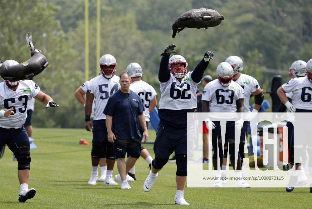 FOXBOROUGH, MA - JUNE 12: New England Patriots offensive lineman Bill Murray  (62) tosses a heavy bag