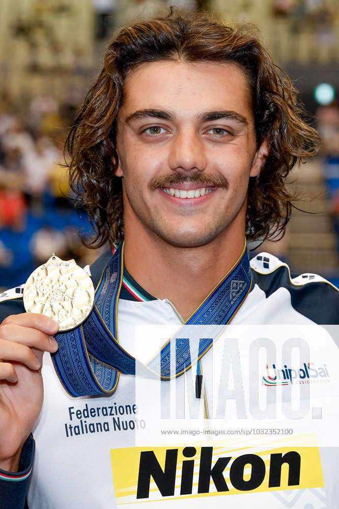 Thomas Ceccon of Italy shows the gold medal after competing in the 50m ...