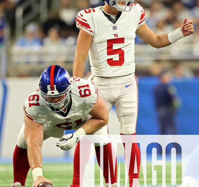 New York Giants quarterback Tommy DeVito (5) avoids Detroit Lions