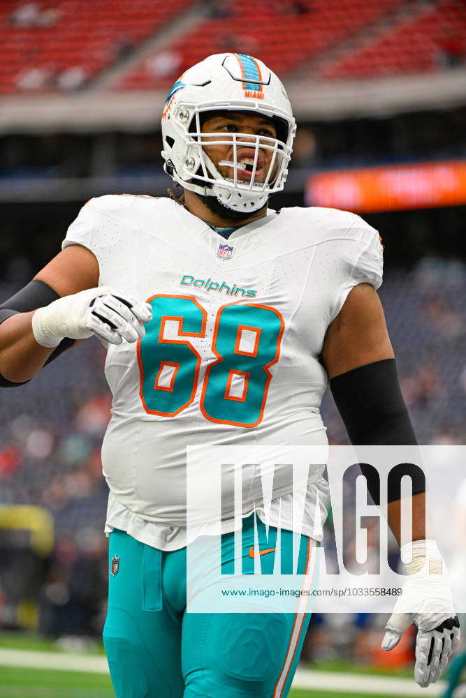 Miami Dolphins offensive tackle Robert Hunt (68) greets a fan on