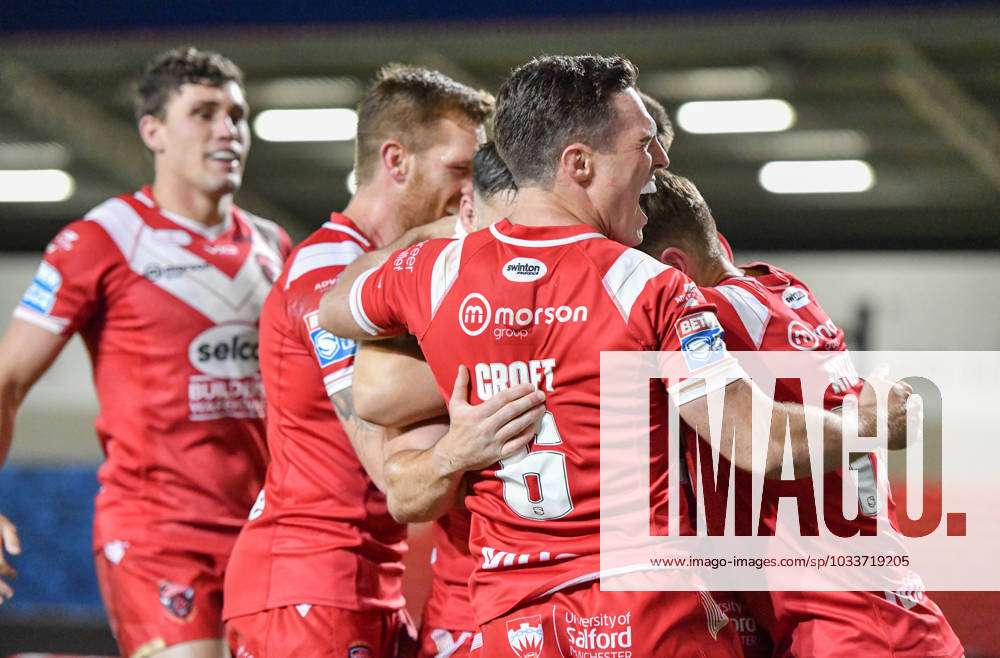 Salford Red Devils celebrate their try during the Betfred