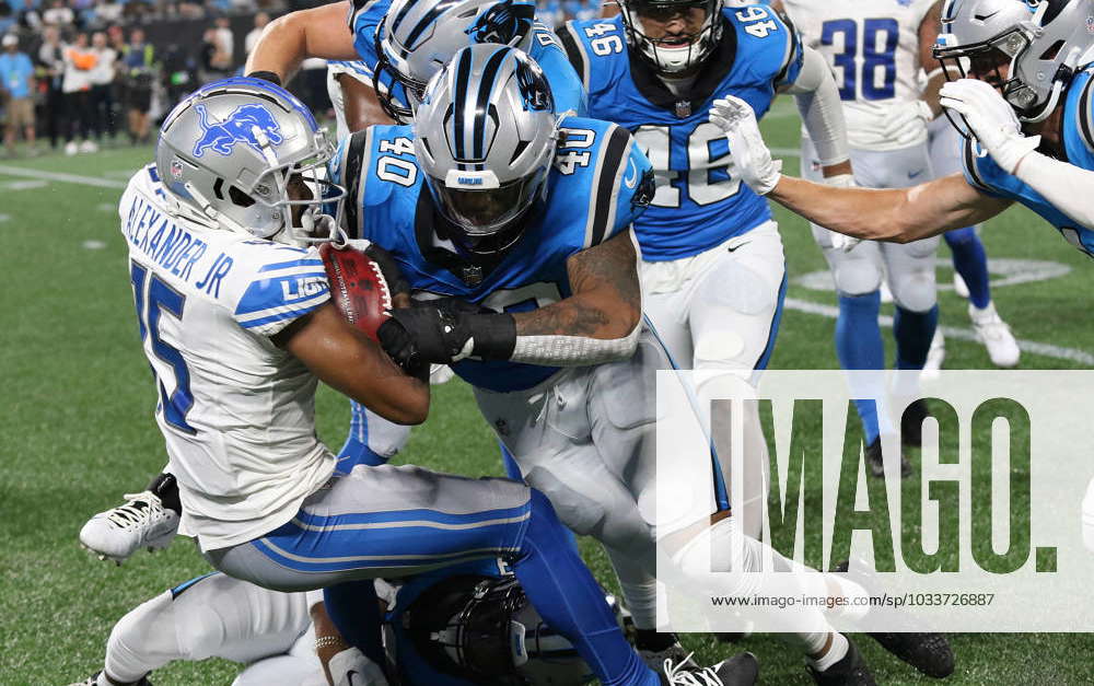 Detroit Lions wide receiver Maurice Alexander (15) is tackled by Carolina  Panthers linebackers Brandon Smith (40) and lBumper Pool (47) during an NFL  preseason football game, Friday, Aug. 25, 2023, in Charlotte