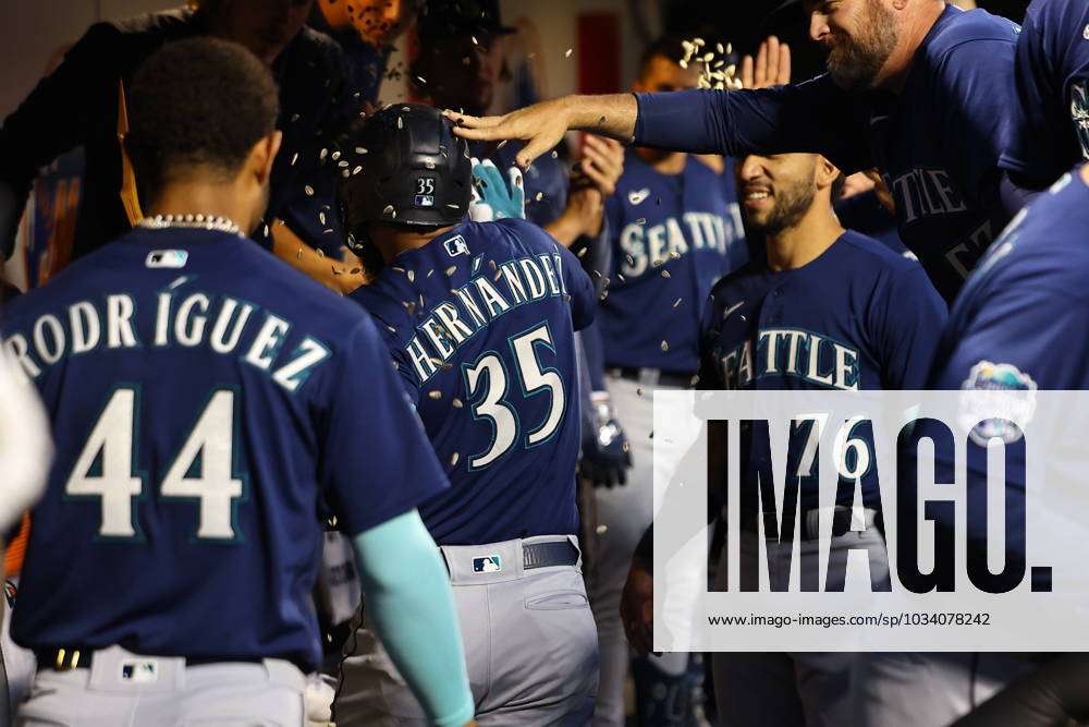 Seattle Mariners Vs. New York Mets Seattle Mariners Teoscar Hernandez 35 is  handed the trident after