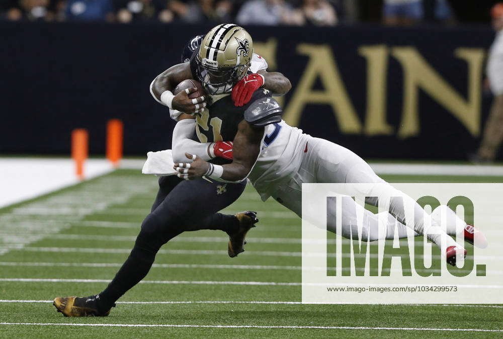 New Orleans Saints running back Jamaal Williams (21) drags Tennessee Titans  linebacker Harold Landry