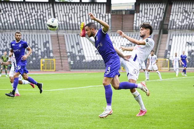 Patro Eisden s Kevin Kis and RSCA Futures Mohamed Bouchouari fight for ...