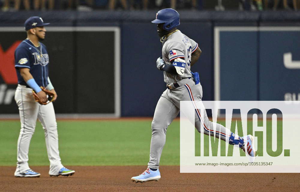 Texas Rangers Adolis Garcia runs the bases after hitting a solo home