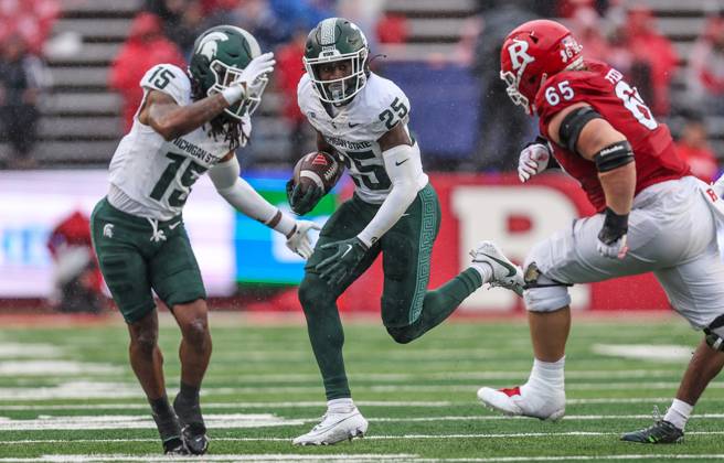 Chance Rucker : Michigan State Spartans defensive back Chance Rucker is tackled after ...