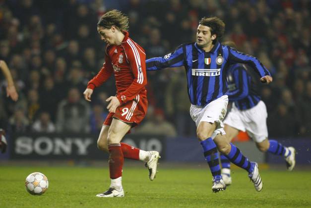 Soccer: Liverpool v Inter Milan FEB 19 February 19, 2008: Liverpool s Fernando Torres and Christian Chivu of Inter Milan during the second round first leg UEFA Champions League football match between Inter Milan and Liverpool at Anfield, Liverpool, England Liverpool United Kingdom EDITORIAL USE ONLY Copyright: xx SimonxBellis CSMx csmphoto080541