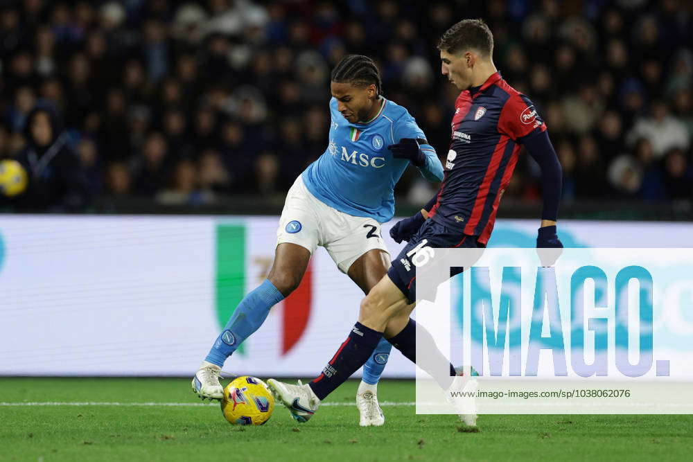 Jens-Lys Cajuste of SSC Napoli competes for the ball with Milan