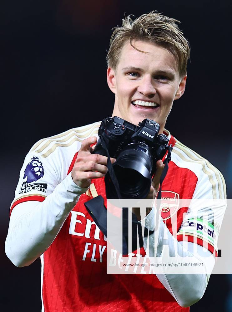 Martin Odegaard Of Arsenal Takes A Camera In His Hands After The Match ...