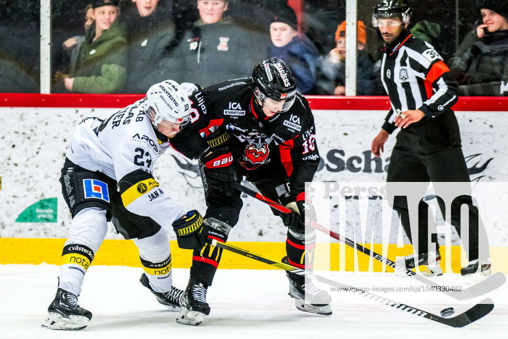 240210 Västeras Adam Hofbauer and Nybros Daniel Ljungman during the ice ...