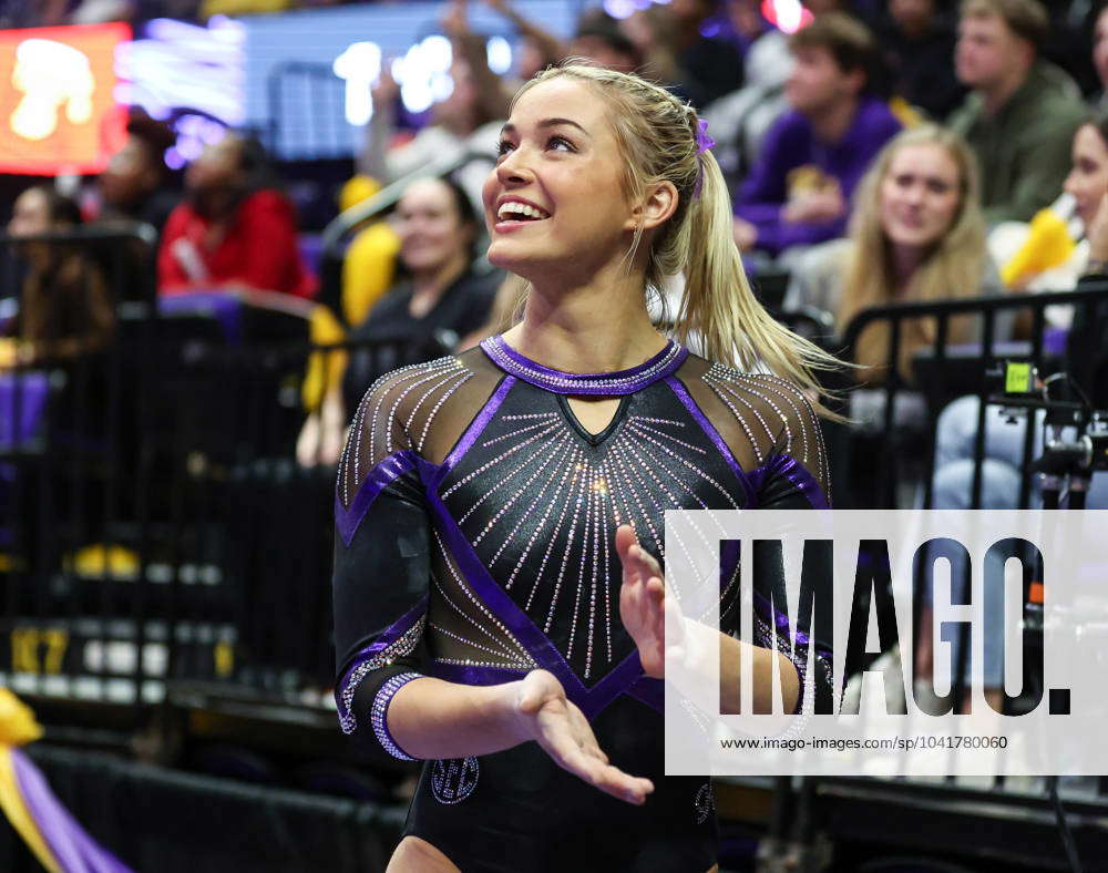 March 1, 2024: LSU s Olivia Dunne smiles as she looks at the video board  during